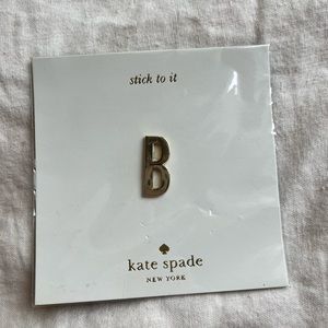 Kate Spade gold accessory decal. Semi permanent sticker.